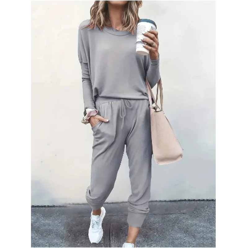 Heather gray women's cozy crew neck and jogger set, offering a relaxed fit for ultimate comfort & style.