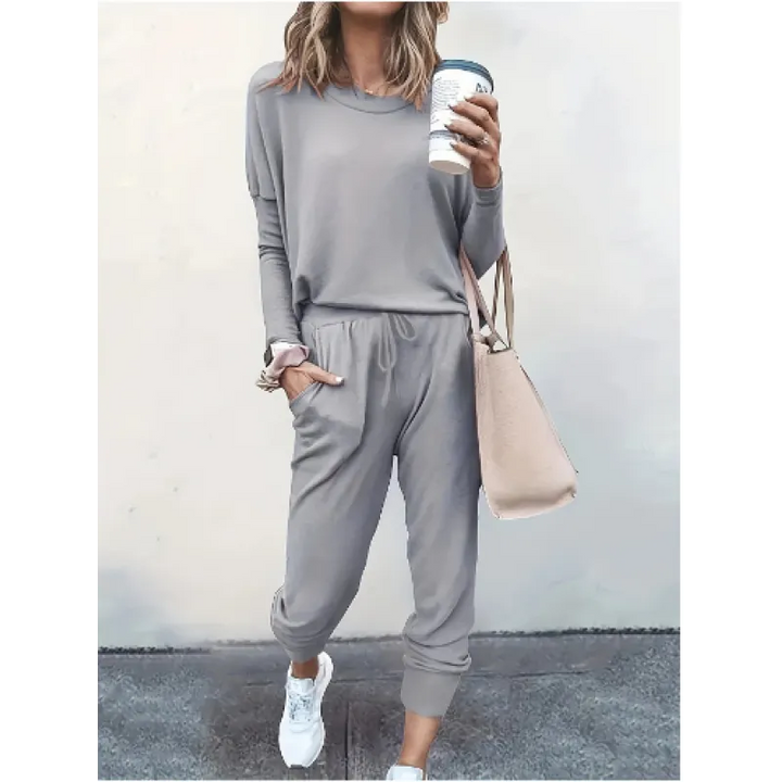 Heather gray women's cozy crew neck and jogger set, offering a relaxed fit for ultimate comfort & style.