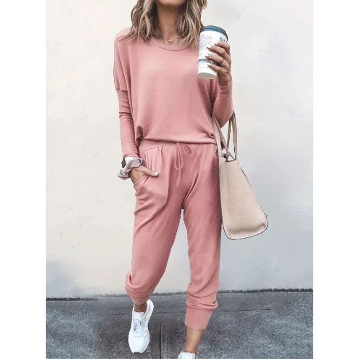 Back view of a woman in a relaxed fit women's cozy crew neck and jogger matching set, ideal for lounging.