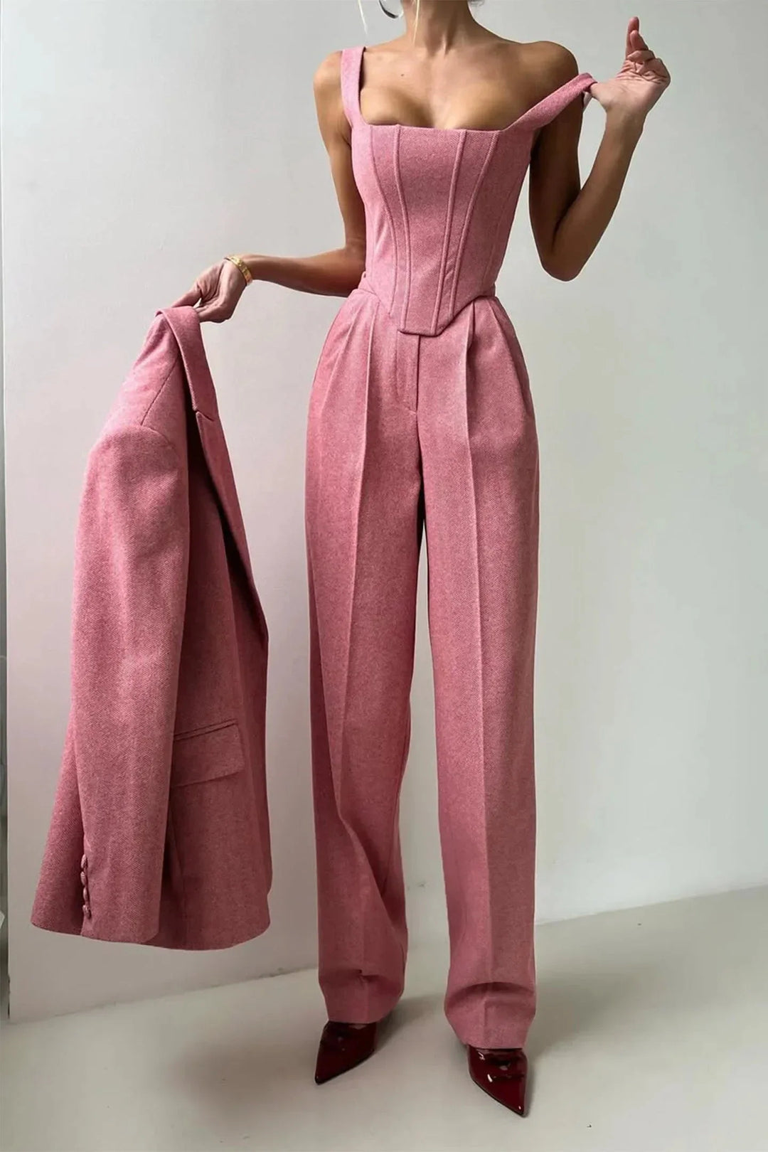 Sleek women's co-ord set: corset bustier, tailored wide leg pants & sophisticated oversized blazer.