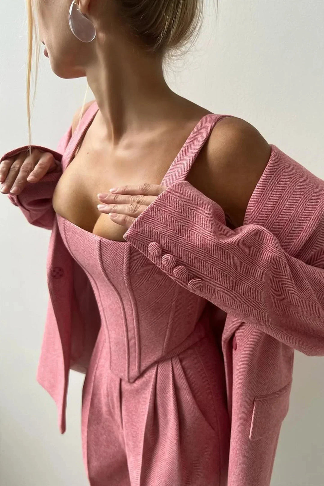 Complete sophisticated women's outfit: corset bustier, wide leg pants, and oversized blazer for an elegant look.
