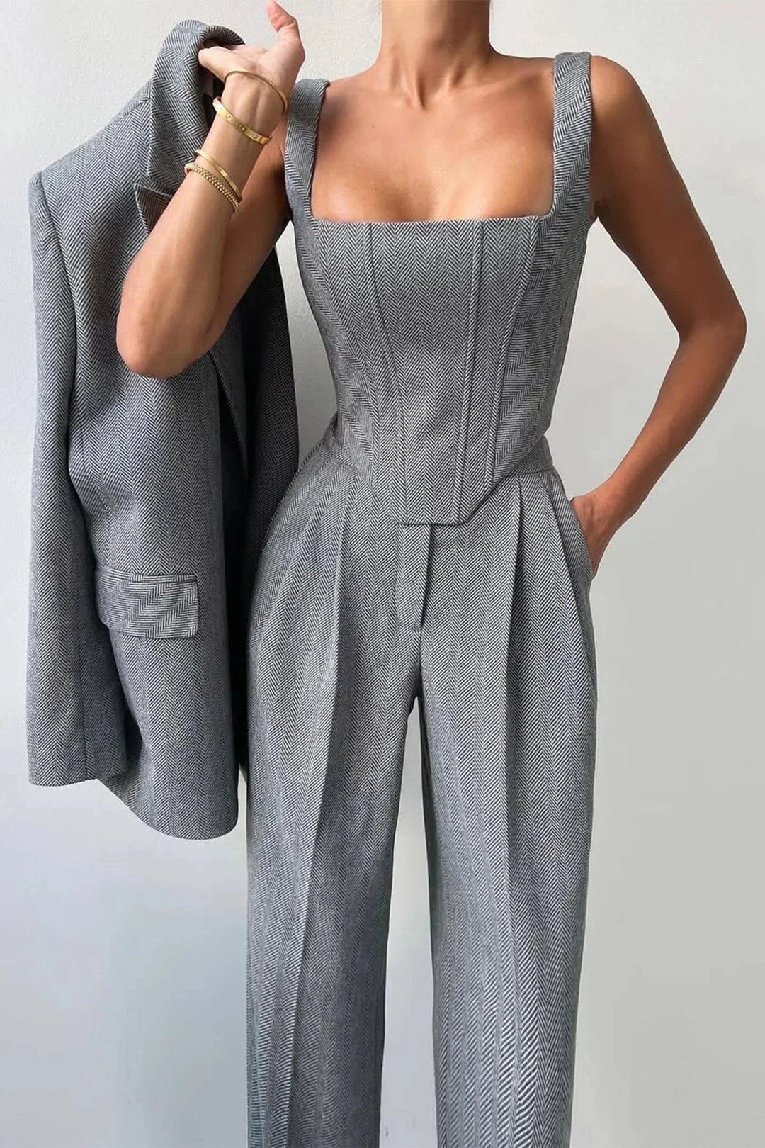 Elegant women's fashion set featuring a corset bustier, wide leg pants & oversized blazer, ideal for business attire.