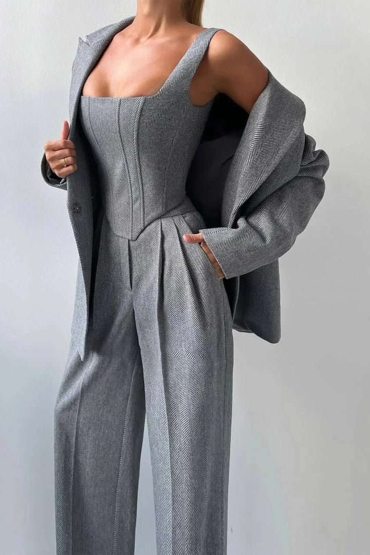 Versatile women's power dressing set: corset top, wide leg trousers & oversized blazer for any occasion.