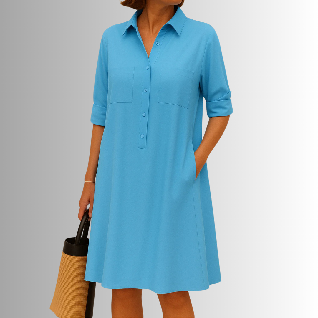 Versatile women's A-line button dress with 3/4 sleeves, collared. Offers comfort and effortless style.