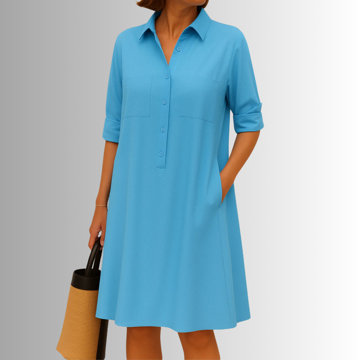 Versatile women's A-line button dress with 3/4 sleeves, collared. Offers comfort and effortless style.