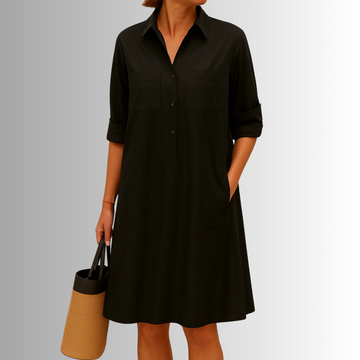 Flattering A-line silhouette women's dress with buttons, collar, and 3/4 sleeves. Chic for any occasion.