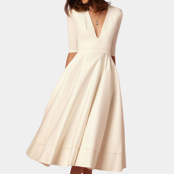 Women's A-line midi dress, sleeveless, featuring an elegant side slit. Perfect for spring and summer fashion.