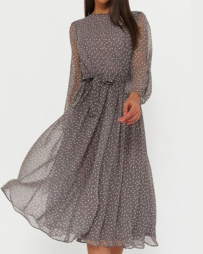 Women's A-line polka dot dress with elegant lantern sleeves. Perfect for spring/summer casual wear.