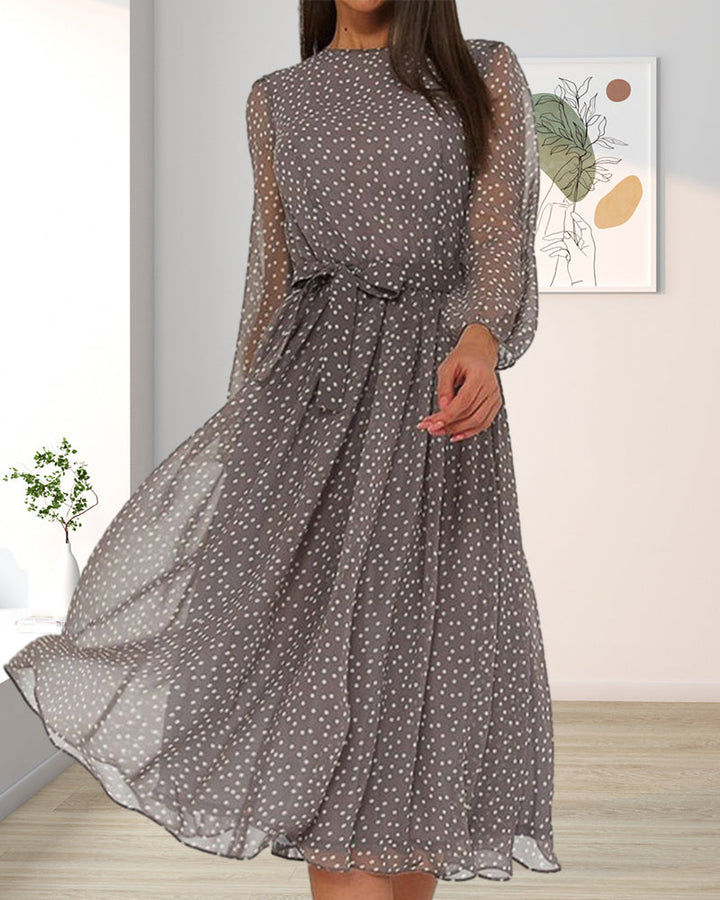 Casual yet elegant women's A-line polka dot dress. Knee-length design with unique lantern sleeves & round neck.