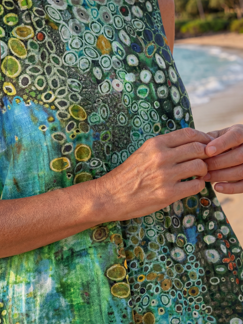 Flowy women's sleeveless midi beach dress with a unique abstract print. Comfortable loose fit, perfect for summer.
