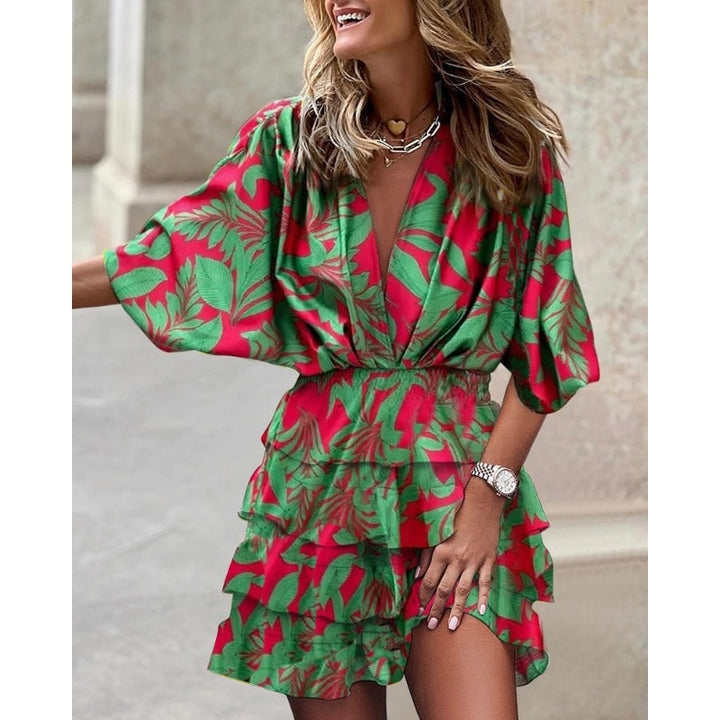 Stylish women's mini dress featuring abstract print, smocked waist, tiered ruffles, and chic V-neck.