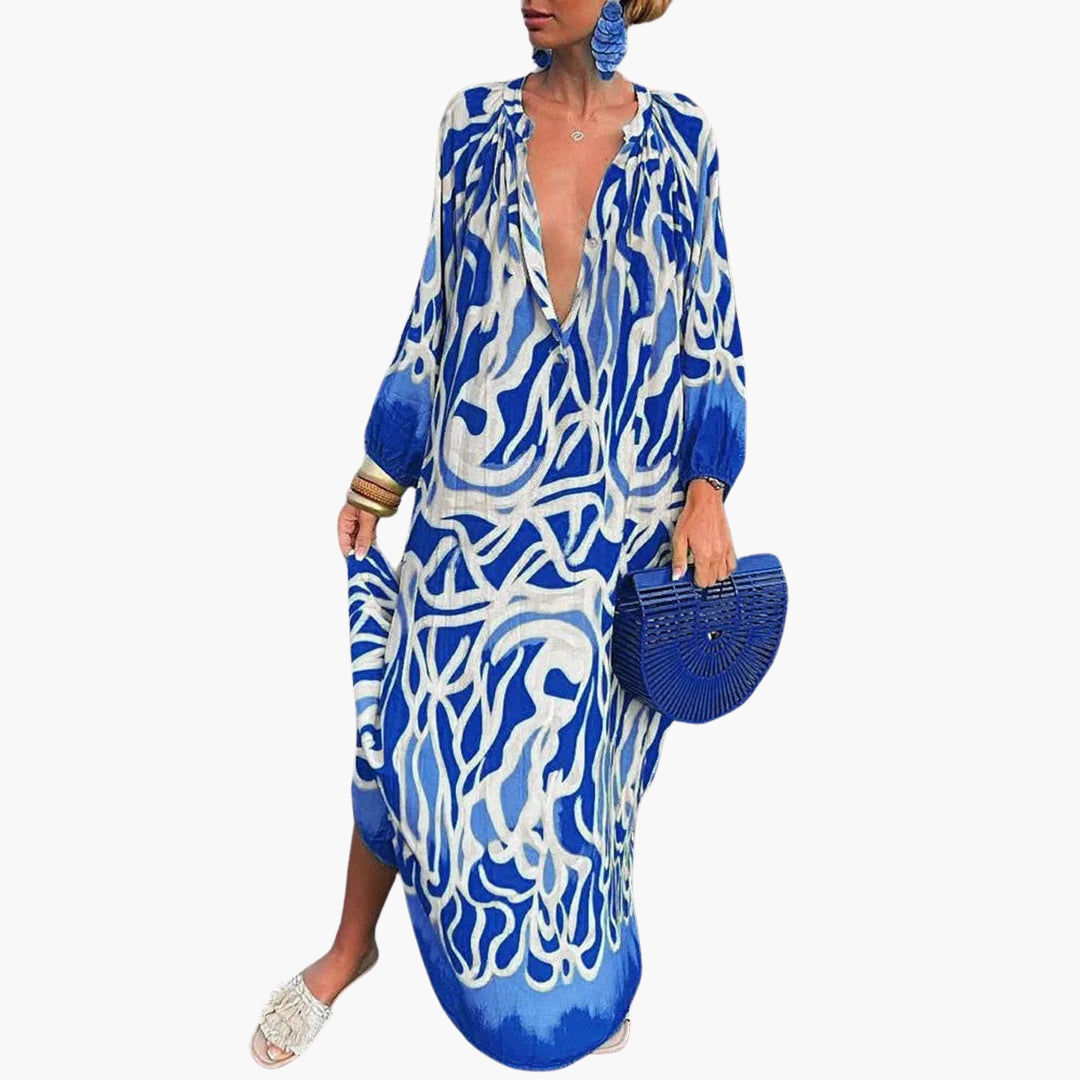 Vibrant abstract print oversized V-neck maxi dress for women. Flowy summer fashion, perfect beach cover-up.