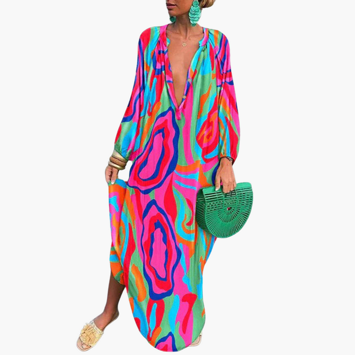 Oversized boho women's maxi dress featuring a unique abstract pattern & V-neck. Perfect casual resort outfit.