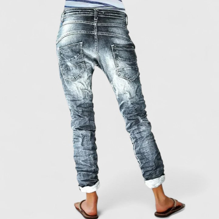 Distressed acid wash skinny jeans for women with a classic button fly closure. Urban, vintage style.