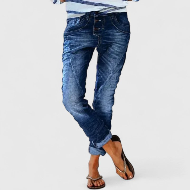 Vintage-style women's acid wash skinny jeans. Features include a button fly, contrast stitch, & distressed details.