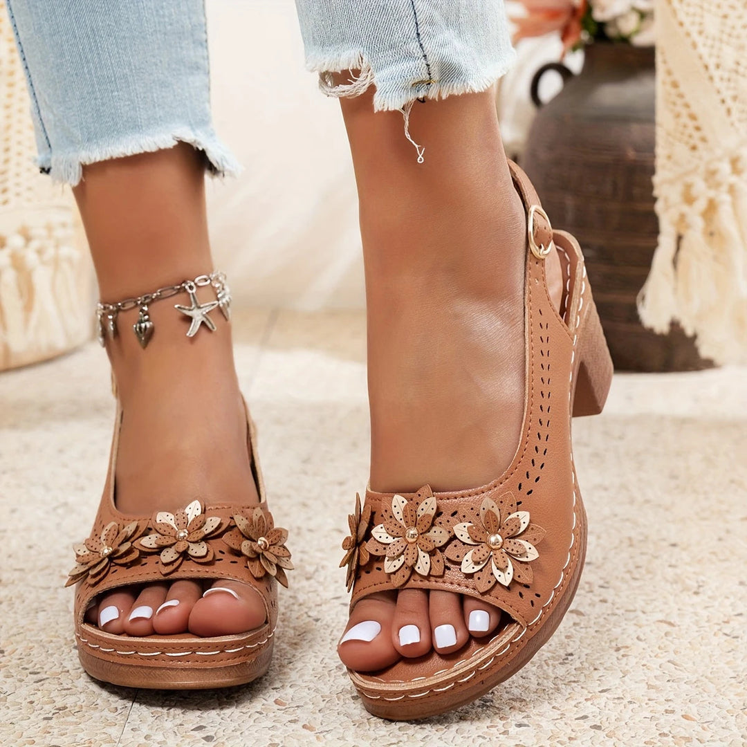 Women's beige flat sandals with adjustable straps, perfect for comfortable summer outfits.