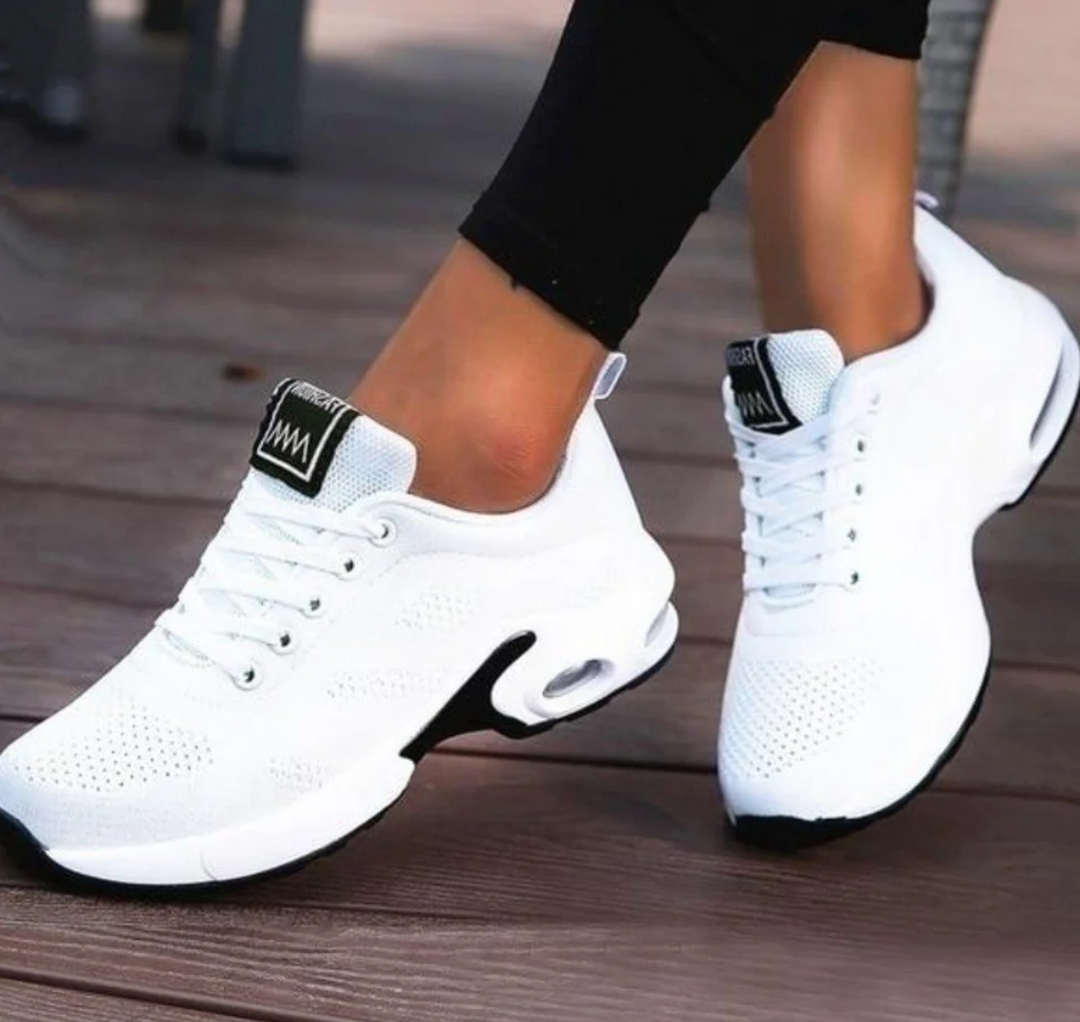 Comfortable women's athletic running shoes with air cushioning & orthopedic support for daily walks.