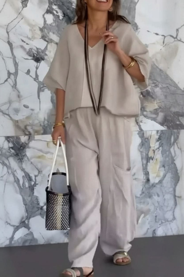 Relaxed fit women's two-piece pantsuit set. Ideal for versatile summer fashion, travel, and effortless style.