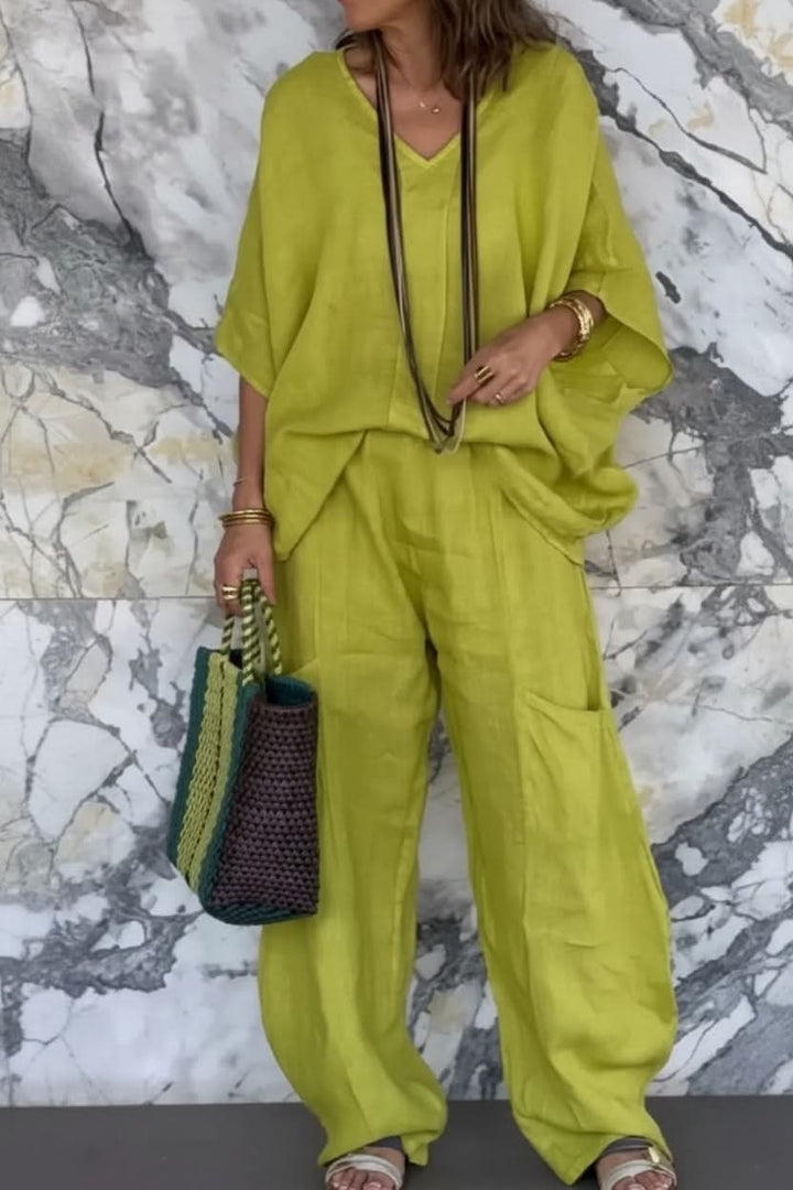 Chic women's open-back pantsuit, an airy two-piece set designed for comfortable & stylish summer outfits.