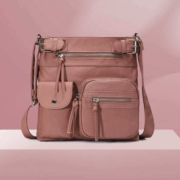 Stylish women's anti-theft shoulder bag with multiple compartments for organized travel.
