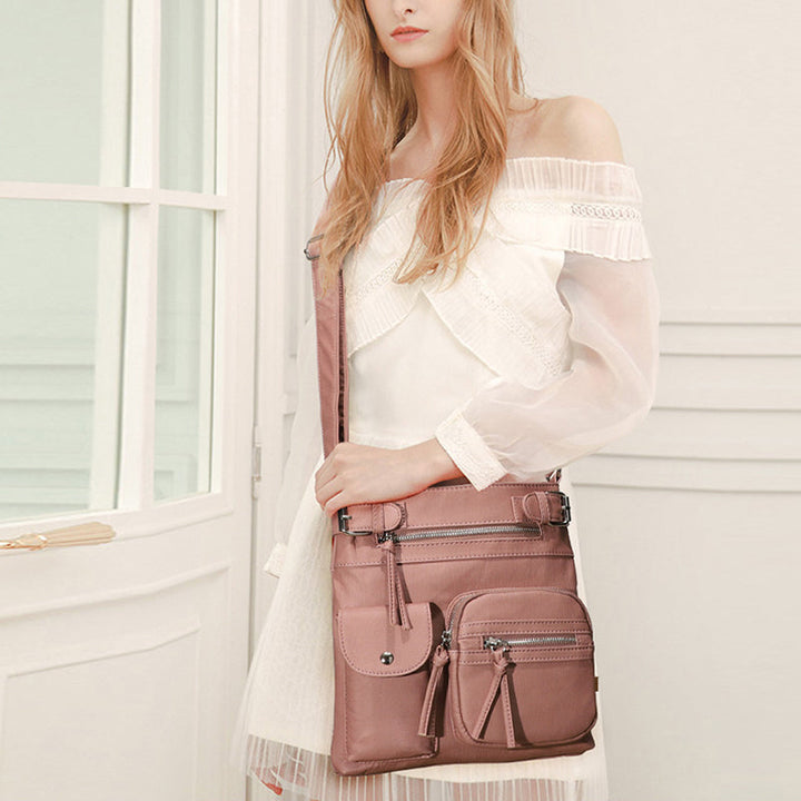 Multifunctional ladies' secure crossbody bag with theft-proof zippers, ideal for travel.
