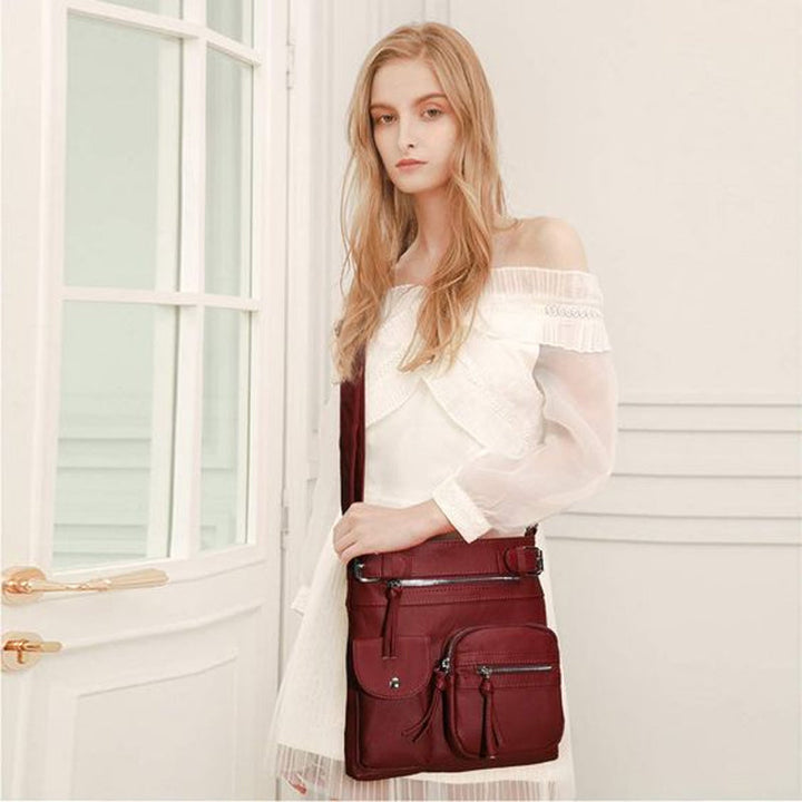 Secure women's travel bag, anti-theft design, worn comfortably across body, protecting essentials.