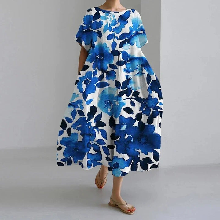 Chic women's relaxed midi dress, artistic print, short sleeves, an effortless addition to summer wardrobe.