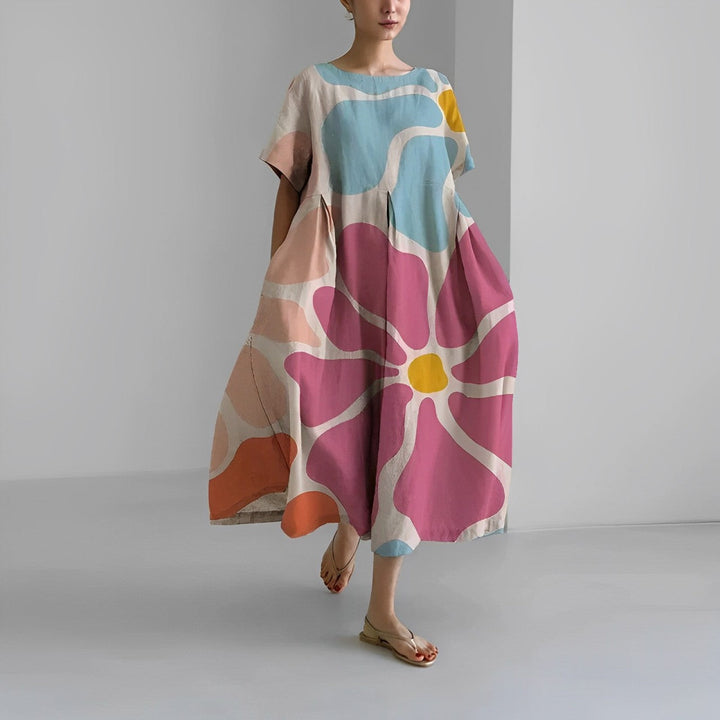 Vibrant artistic print women's midi dress with a relaxed fit, ideal for summer vacation.