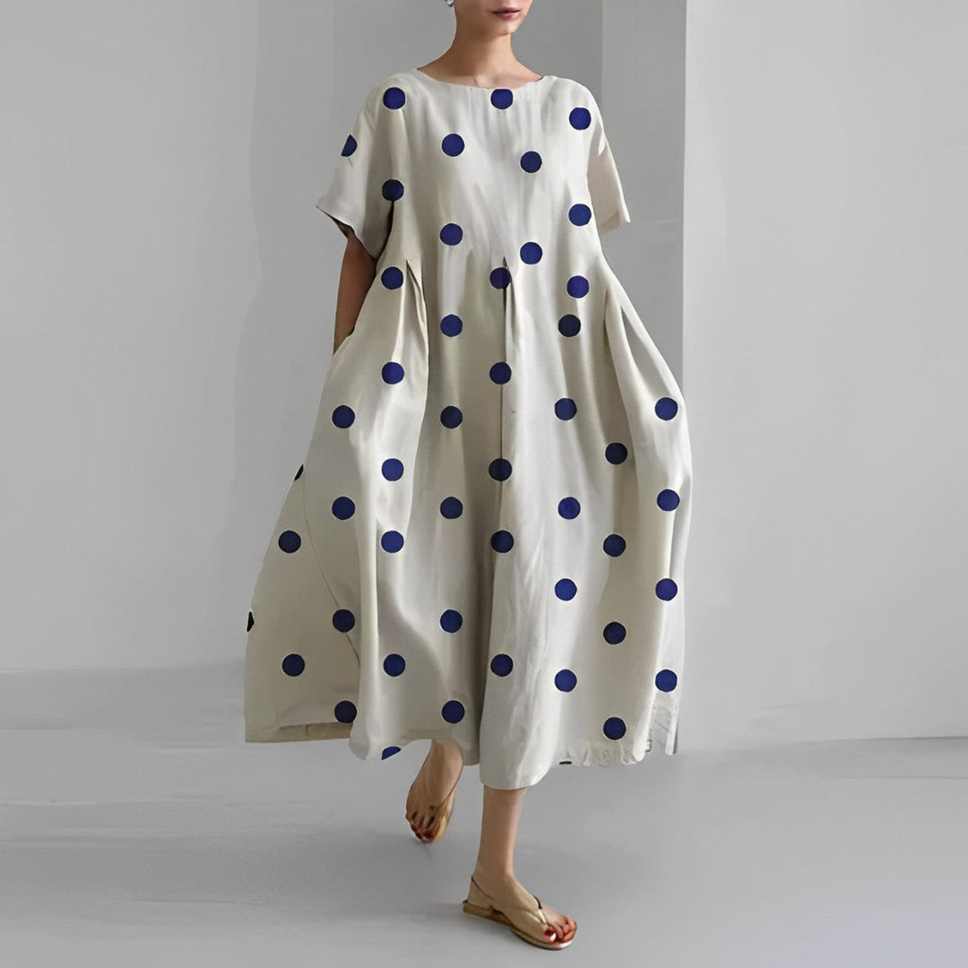 Casual women's artistic print midi dress, relaxed fit, short sleeves, perfect for summer comfort.