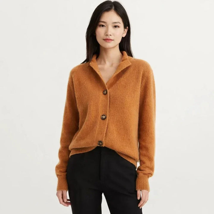 Women's asymmetrical knit cardigan with button placket. Perfect for fall fashion.