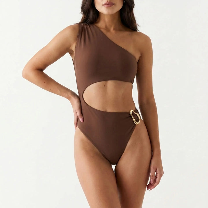 Sophisticated women's asymmetrical cut-out monokini. This designer quality one-shoulder swimsuit is perfect for resort wear.