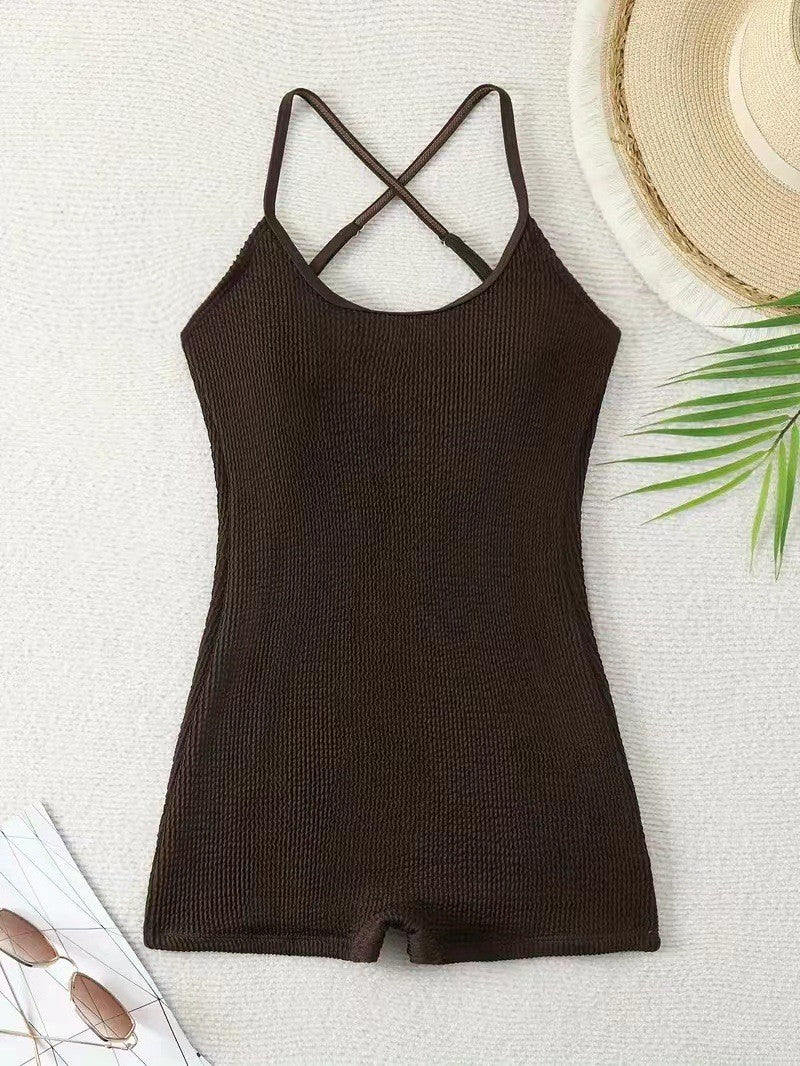 Women's athletic ribbed monokini, a sleek tank style one-piece swimsuit for sporty activewear & beach fun.