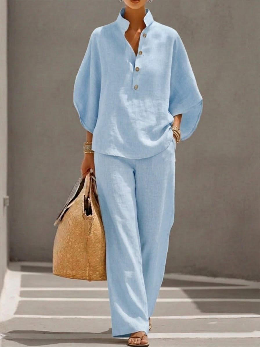 Elegant women's coordinating set featuring a chic batwing top and comfortable wide-leg trousers, ideal for casual wear.