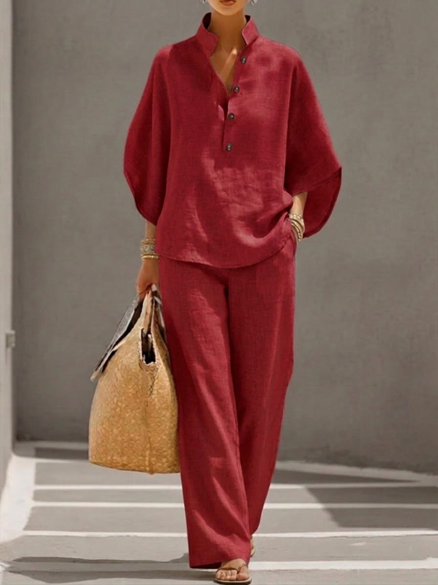 Stylish women's fashion set: batwing blouse & wide trousers, a perfect summer outfit for an effortless & elegant look.