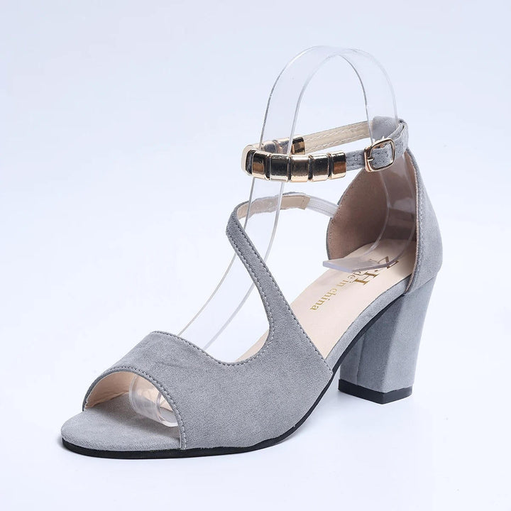 Stylish women's dress sandals, featuring an elegant beaded ankle strap and supportive block heel.
