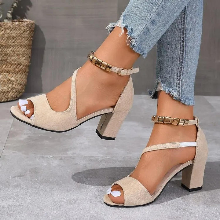 Elegant open toe women's sandals featuring intricate beading and a comfortable ankle strap.
