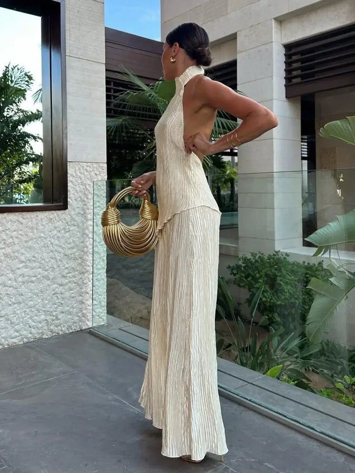 White pleated halter neck two-piece set, women's wide-leg pants. Stylish summer matching outfit, casual chic.