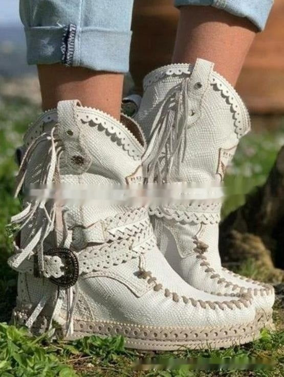 Boho western women's ankle boots, featuring playful fringe and a comfortable flat design for casual wear.