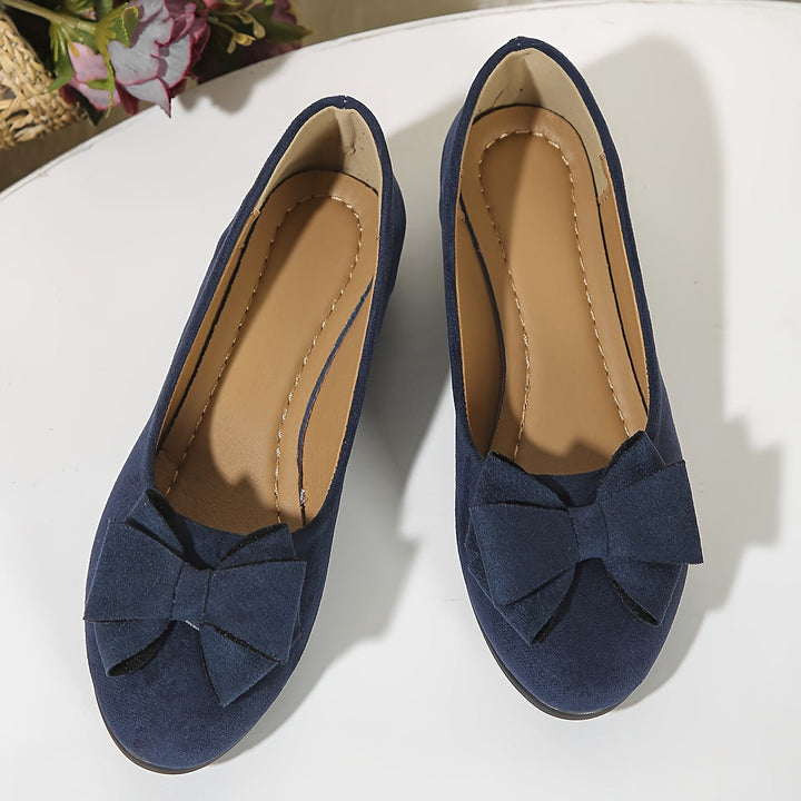 Simple elegant women's round toe wedge flats, slip-on with delicate bow.