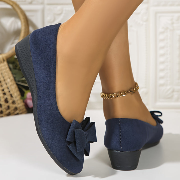 Flexible women's wedge ballet flats, slip-on, round toe, and decorative bow.