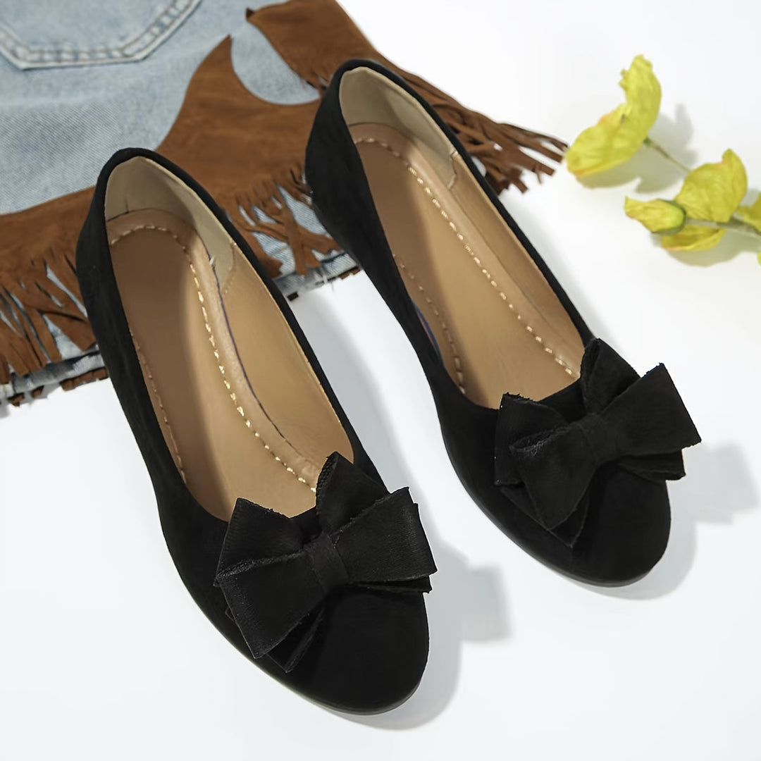 Versatile women's everyday ballet flats, comfortable wedge, round toe, bow detail.