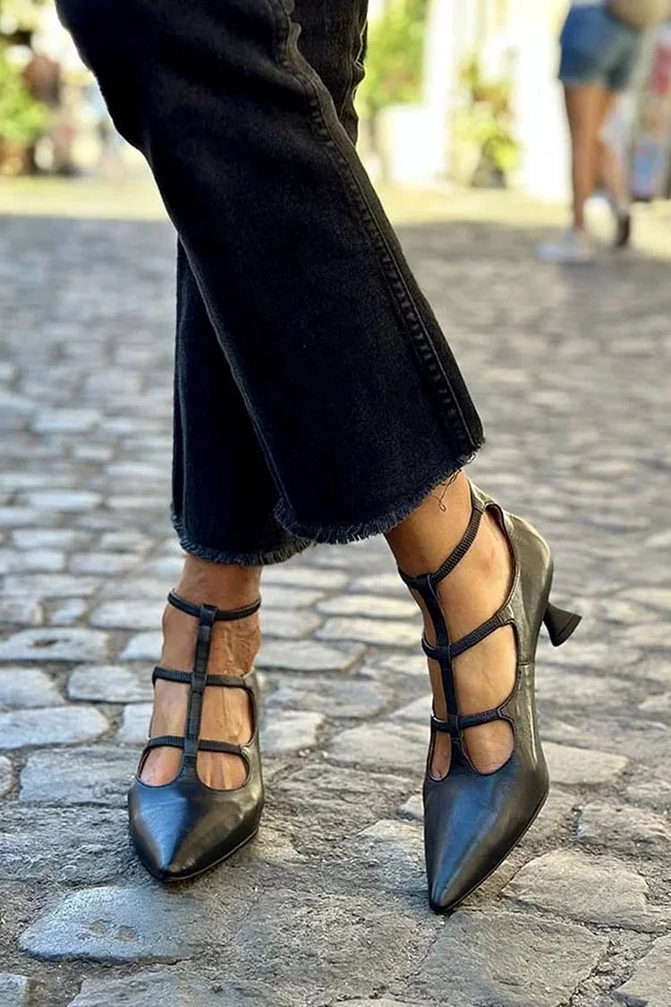 Women's black cage strap pointed toe kitten heel pumps, elegant strappy heels for wedding, evening, or party.