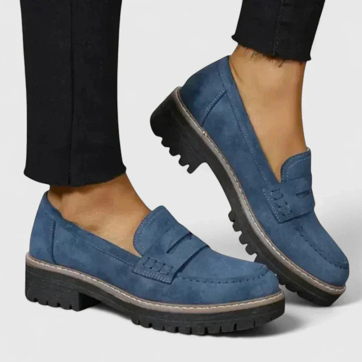 Fashionable women's chunky lug-sole penny loafers with a classic penny strap, ideal for work & everyday.