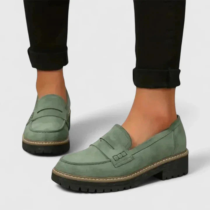 Durable women's chunky lug-sole penny loafers, offering a modern twist on classic casual shoes.