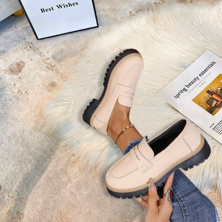 Modern women's slip-on platform loafers featuring a bold chunky sole, ideal for versatile styling.
