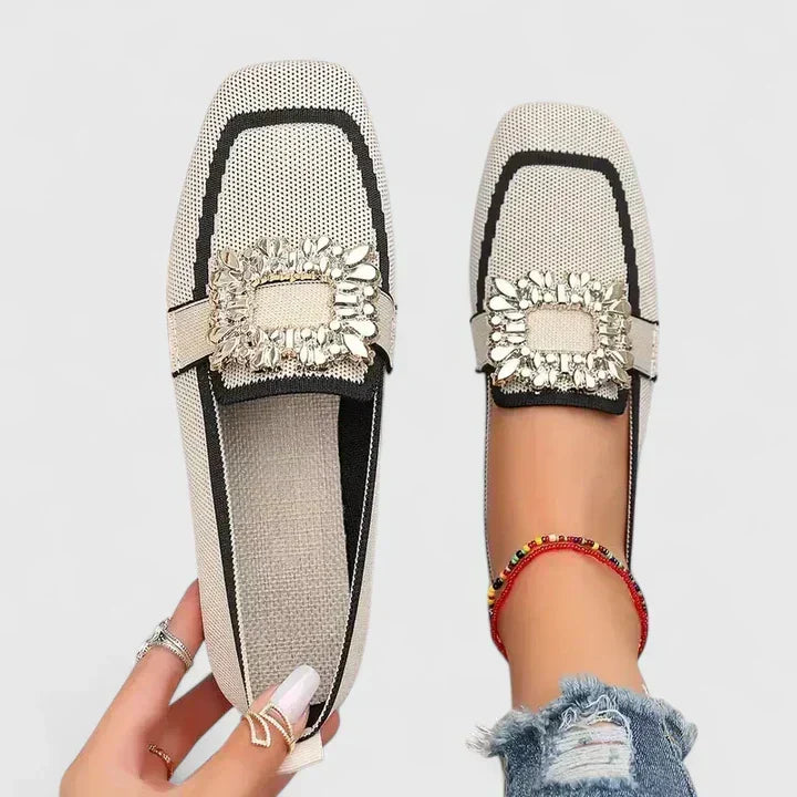 Women's black crystal square-toe flat loafers. Elegant slip-on comfort for dress or casual chic fashion.