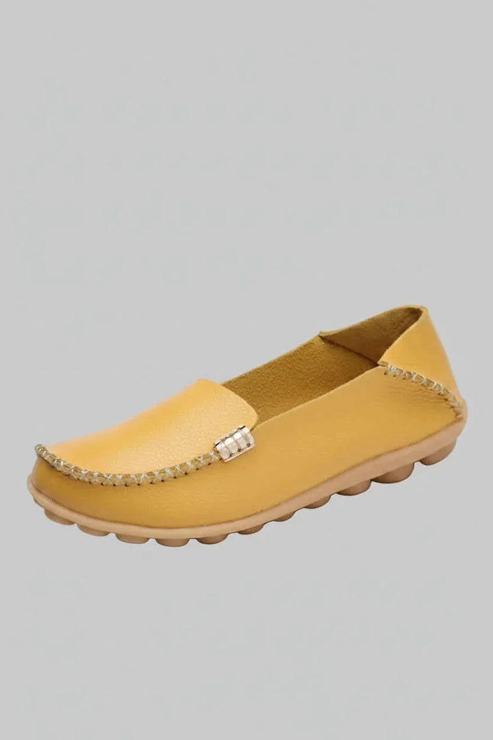Front view of women's comfortable walking flats with a round toe & soft cushioning for travel & daily use.