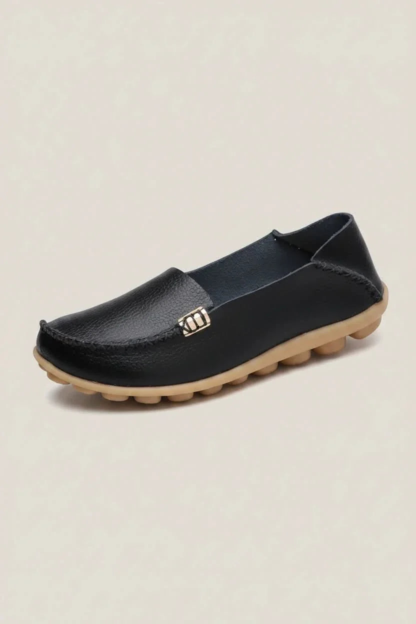 Women's classic black round-toe slip-on flats with superior cushioning for work, travel, and casual outings.