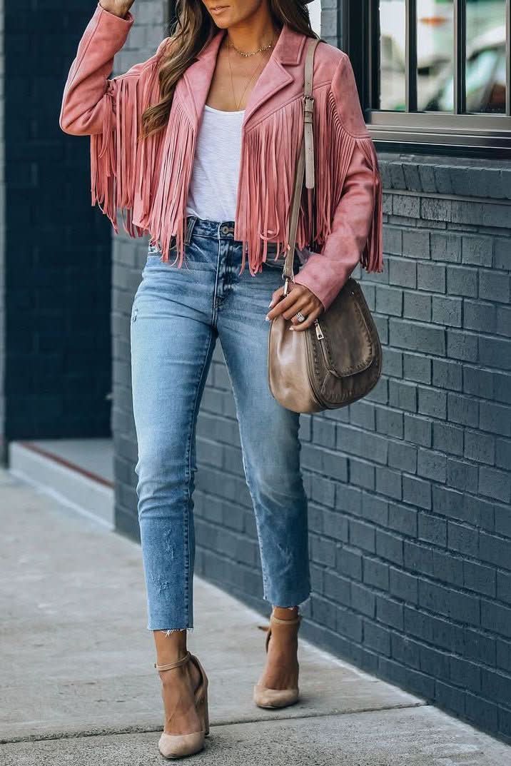 Stylish women's fringed moto jacket, perfect outerwear for a confident, edgy look. Versatile for fall/spring.