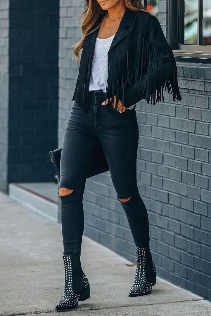 Close-up of the fringe detail on a women's moto jacket, showcasing its unique modern fit & bold style.